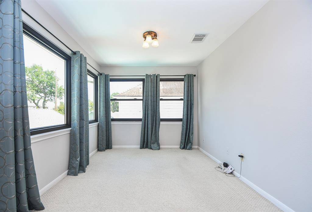 Use this area in the primary bedroom for your study, as an exercise area or as an additional seating area.
