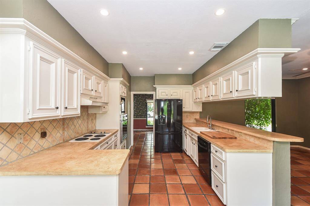 The galley kitchen allows for plenty of cabinet and counter space.The refrigerator, washer and dryer will remain.