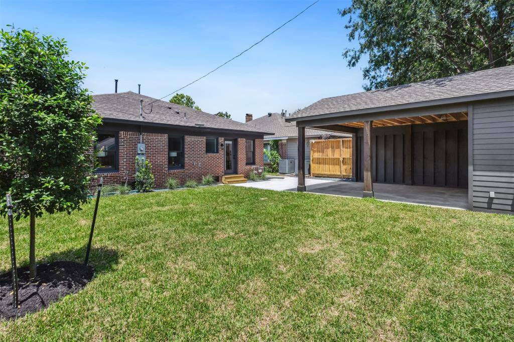 New covered carport with spacious storage closet