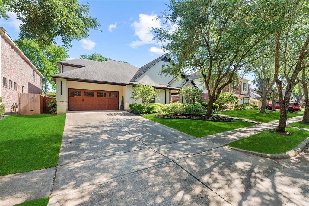 The front and back yards are professionally landscaped with lush greenery and inviting appearance. Thoughtful design and expert execution create a seamless outdoor living experience that enhances both beauty and functionality.