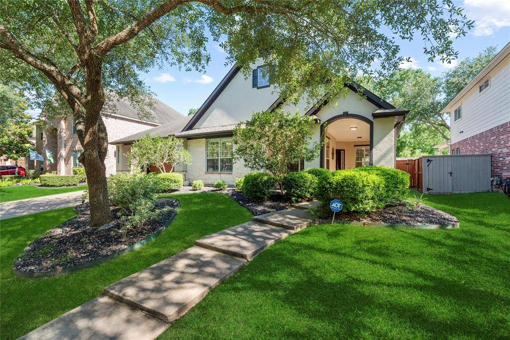 This professionally painted exterior stucco showcases a smooth, flawless finish that enhances curb appeal. Accented with stylish dark trim, the modern design creates a striking contrast for a clean, contemporary look.