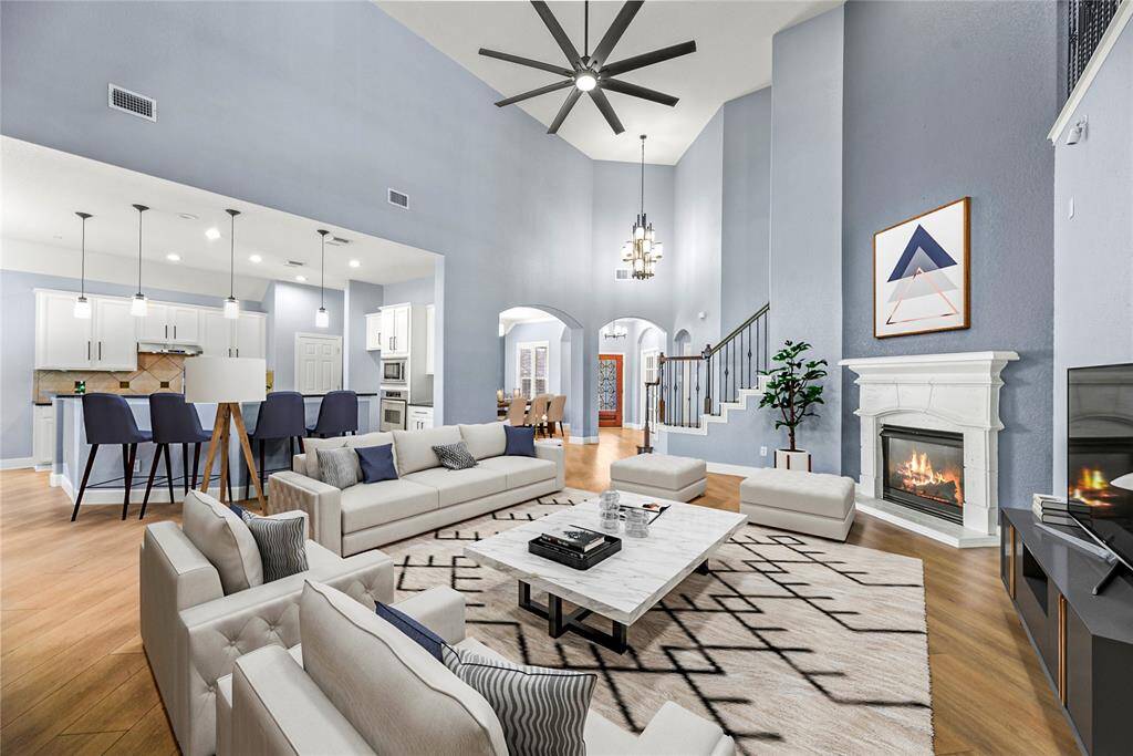 Welcoming and conveying warmth, the living room offers an inviting space for evening movies or holiday gatherings. Tune into your favorite streaming show, while admiring the cozy fireplace.