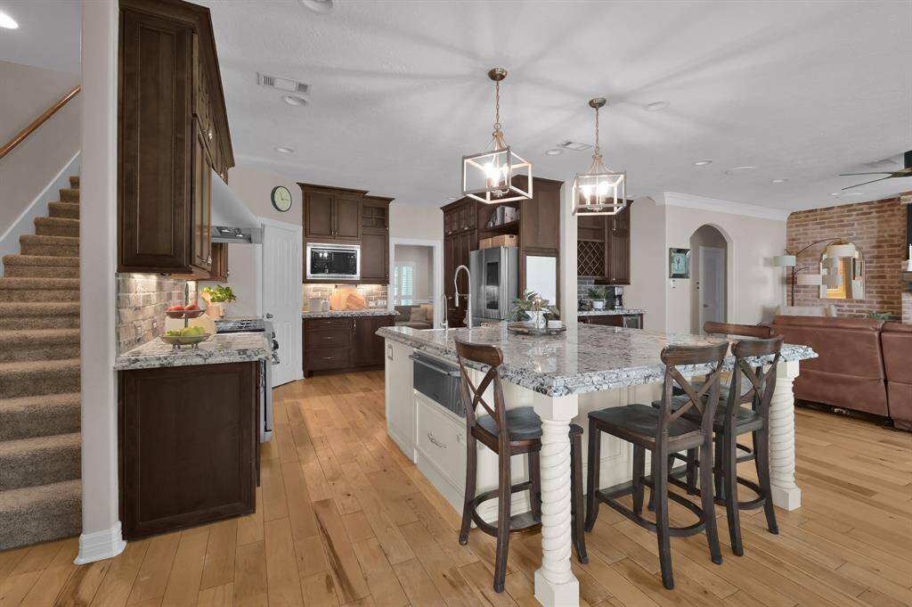 A second staircase is located right behind the kitchen and can access the second floor living space