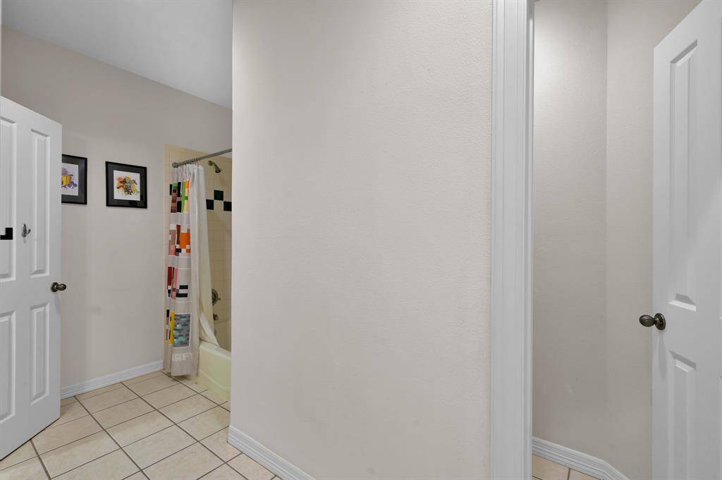 The large shower/tub combo and separated commode.