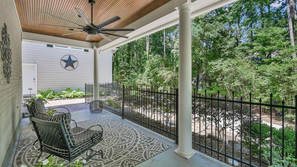 Covered patio by the second entrance by the kitchen is perfect to enjoy your morning cup of coffee or reading a good book