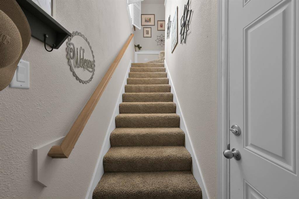 A staircase leads the way into the garage apartment