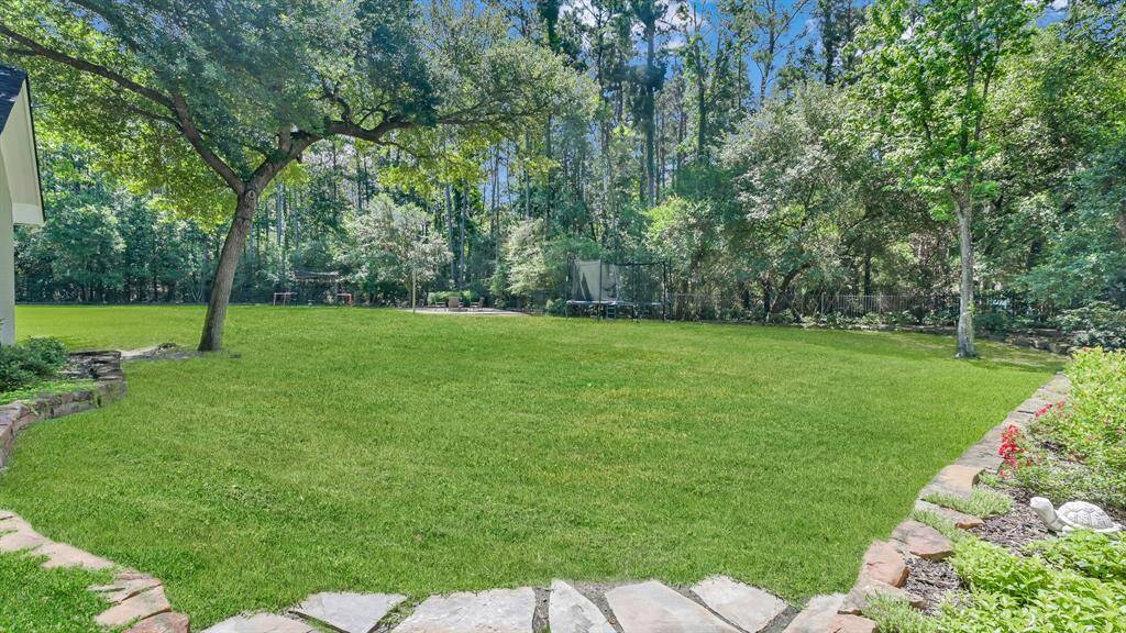 A massive open green space is ready for many different uses. A complete blank canvas ready for your private pool!