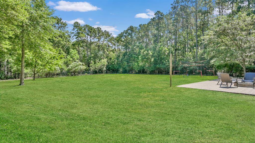 Completely fenced and surrounded by trees, this is truly a private back yard.