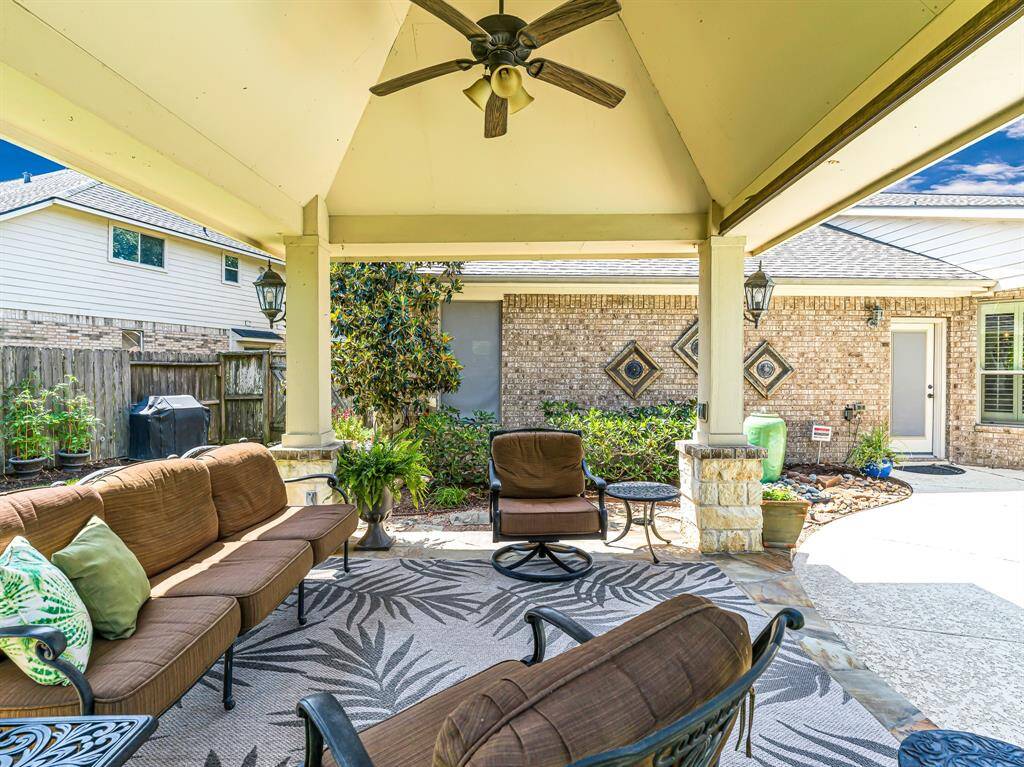 The cabana is thoughtfully designed with a ceiling fan and light kit, ensuring comfort and functionality whether it's day or night. Carriage lighting adds a touch of elegance, casting a warm, inviting glow over the space in the evening.