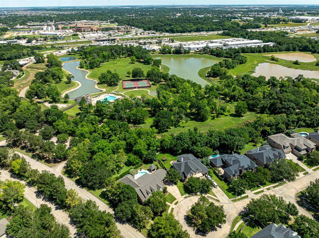 This aerial view captures the community amenities in the backdrop, all conveniently within walking distance.