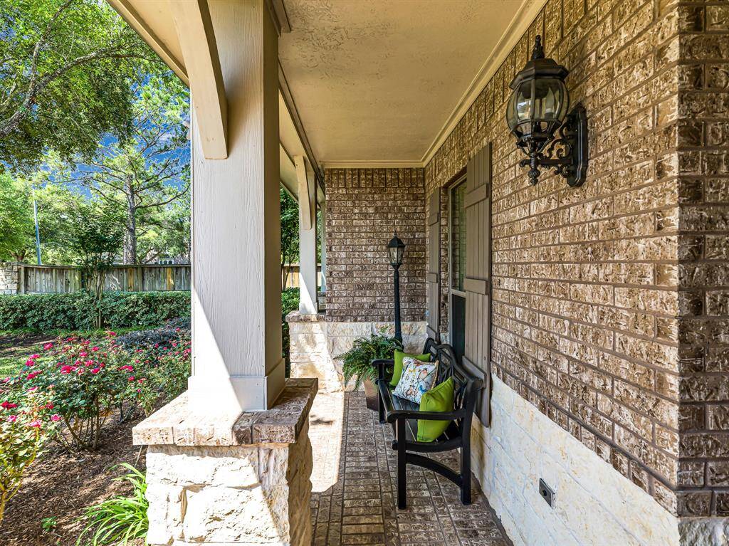 The covered front porch overlooks the lush front yard, providing a peaceful spot to sit and reflect, enjoy your morning coffee, or watch the kids play safely in the quiet cul-de-sac.
