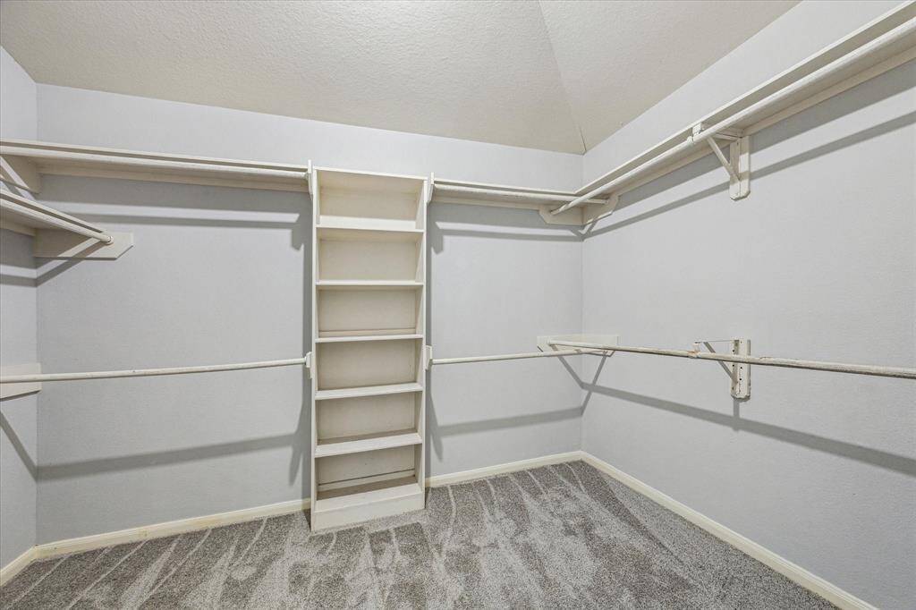 Primary closet is oversized with plenty of hanging space.