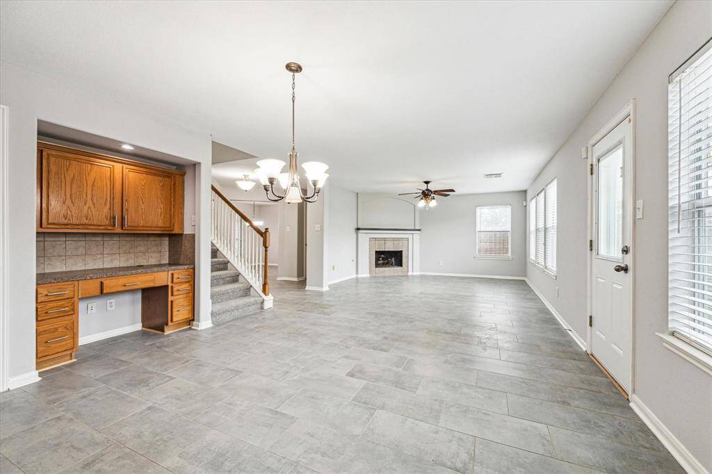 The large living/dining/kitchen is open and bright.