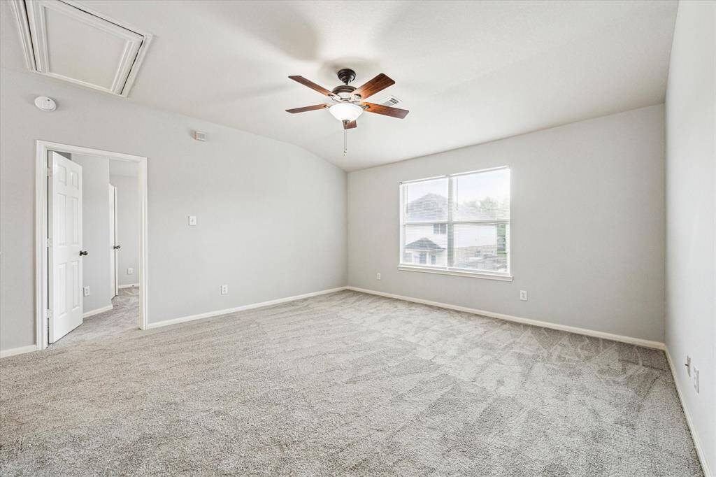 Upstairs features a large family room in between the primary and guest bedrooms.