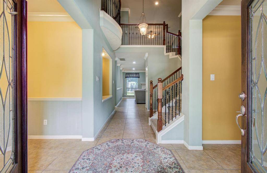 Entrance formal living room on right and formal dining on left