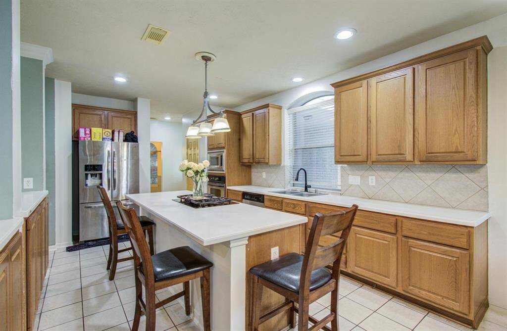 Cabinets galore with this island for a quick family breakfast