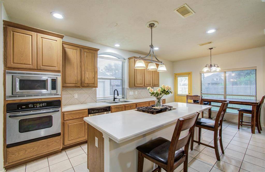 Another kitchen view. Island eat in with separate table