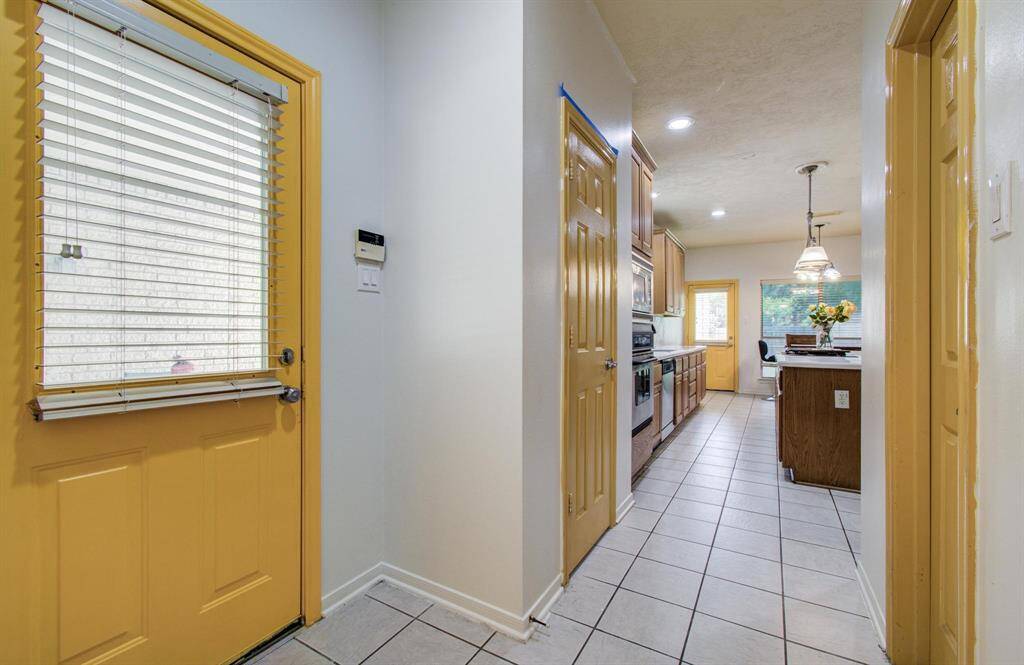 This home has two back door entrances.  Easy from the garage with your groceries and the other directly into the backyard