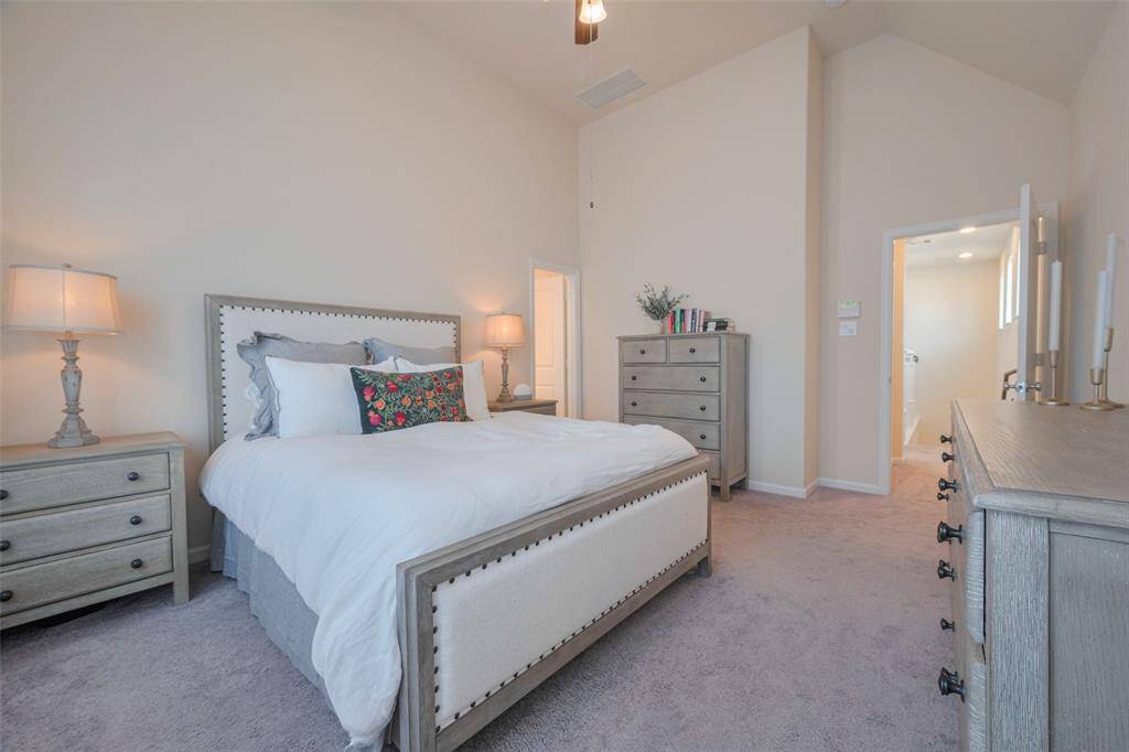 Spacious primary suite with vaulted ceilings