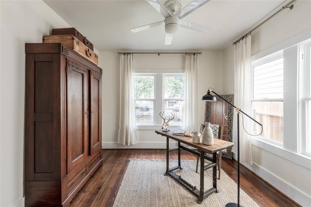 Original hardwoods, tall windows, and soft natural light make this space both inspiring and grounded.