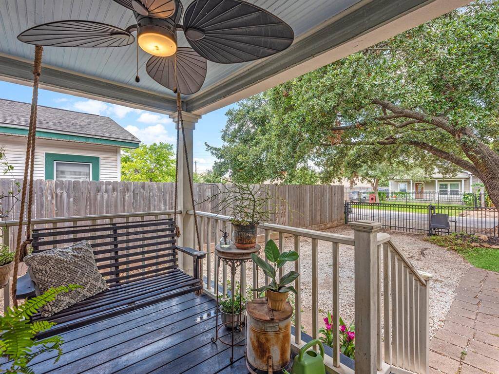 Enjoy slow mornings or shaded evenings on the front porch, complete with a porch swing and views of the gated front yard.