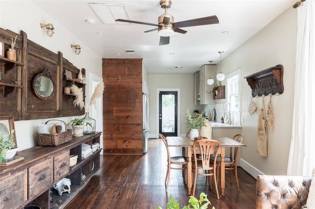 From the heart of the home, enjoy an open flow to the dining area, custom kitchen, and sunlit back entry—bathed in light and thoughtfully connected.