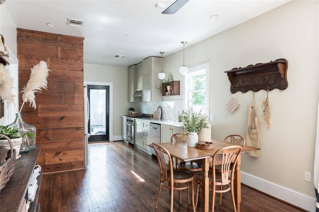 From the heart of the home, enjoy an open flow to the dining area, custom kitchen, and sunlit back entry—bathed in light and thoughtfully connected.