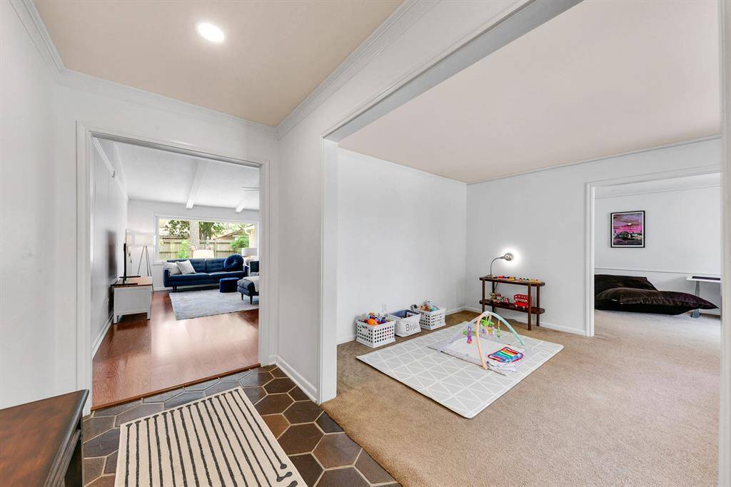 Flex room located just off the entry, perfect for a formal dining area, home office, or additional living space
