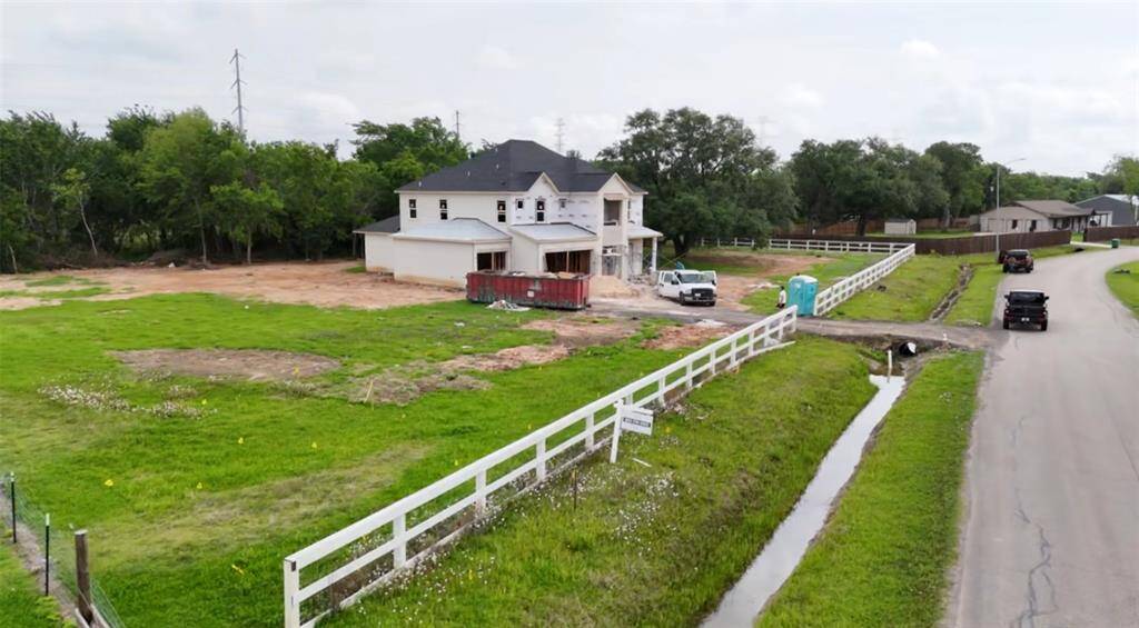 A fresh start on a fully fenced, full acre of possibilities!