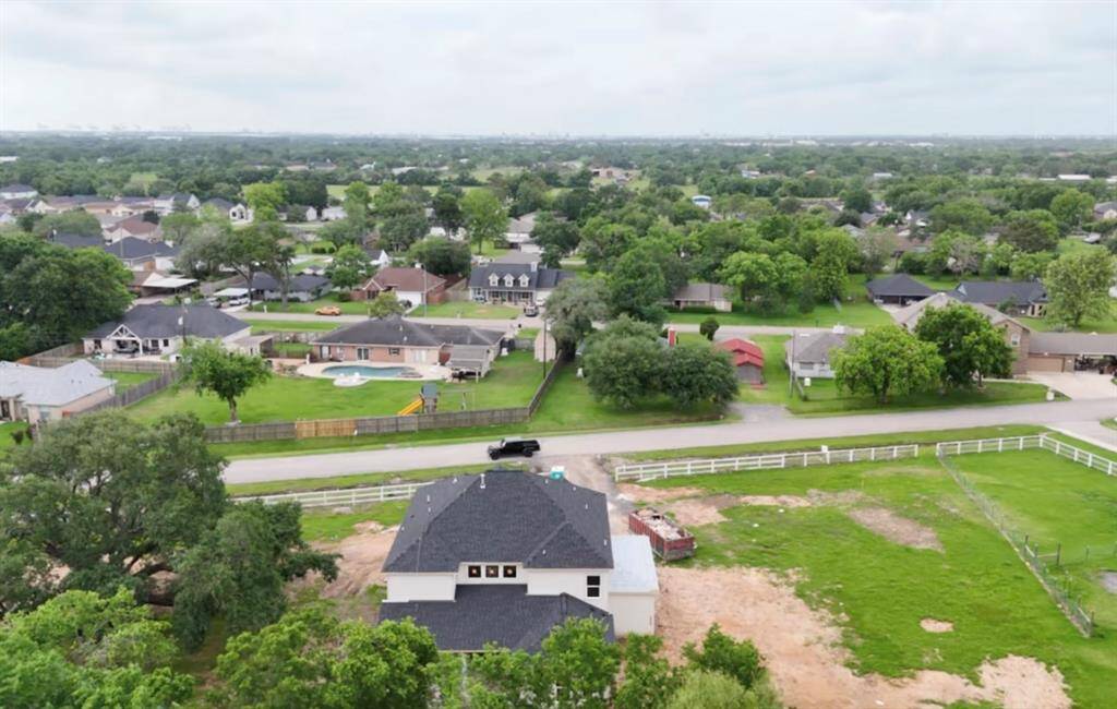 Nestled in La Porte’s highly coveted large lot district, the backyard includes a massive back patio with two ceiling fans for you to enjoy your full acre of land!
