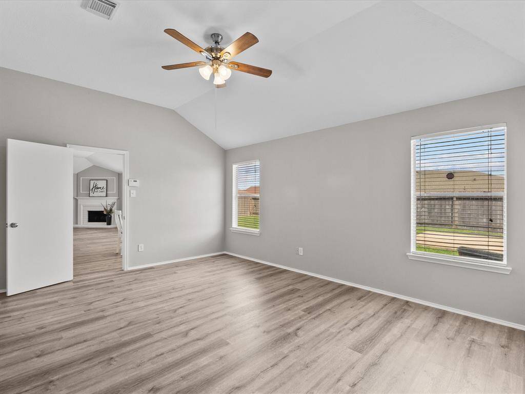 The vaulted ceiling makes this bedroom feel like an expansive retreat.