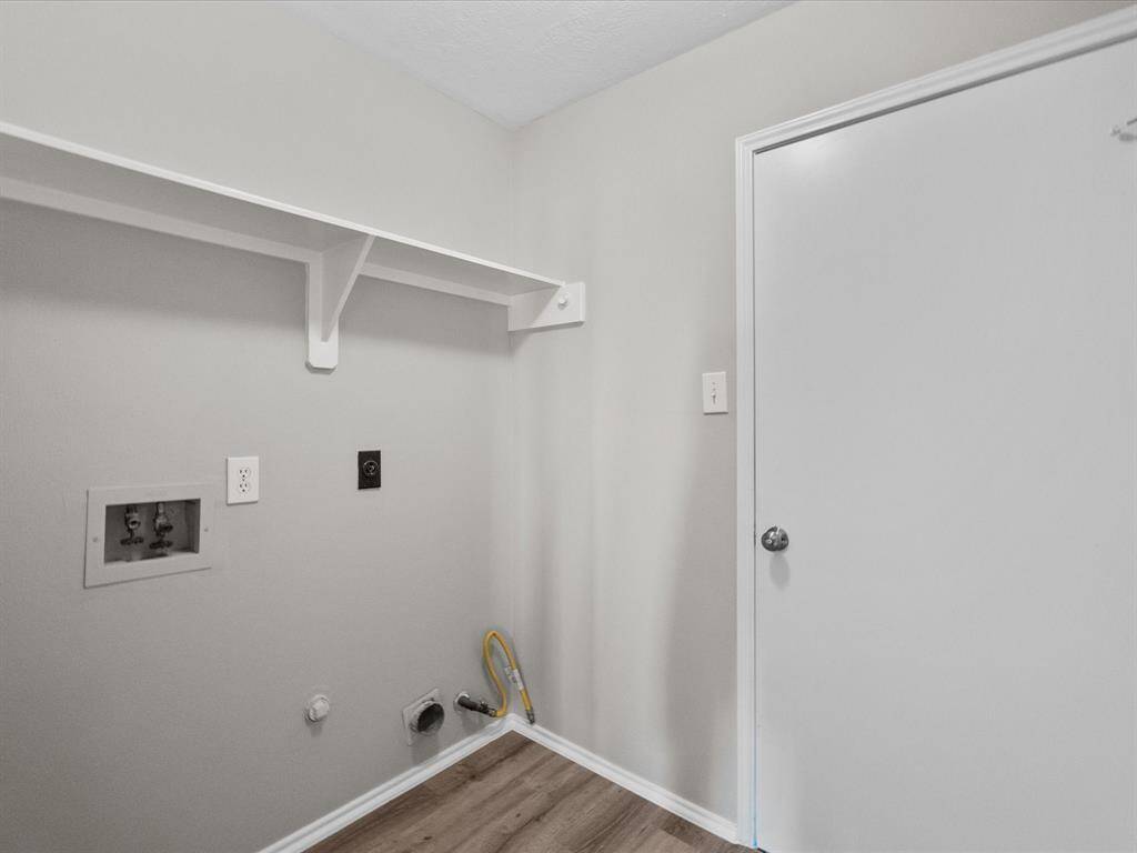 Conveniently located off the kitchen, the laundry room offers easy garage access. Both gas and electric dryer connections available