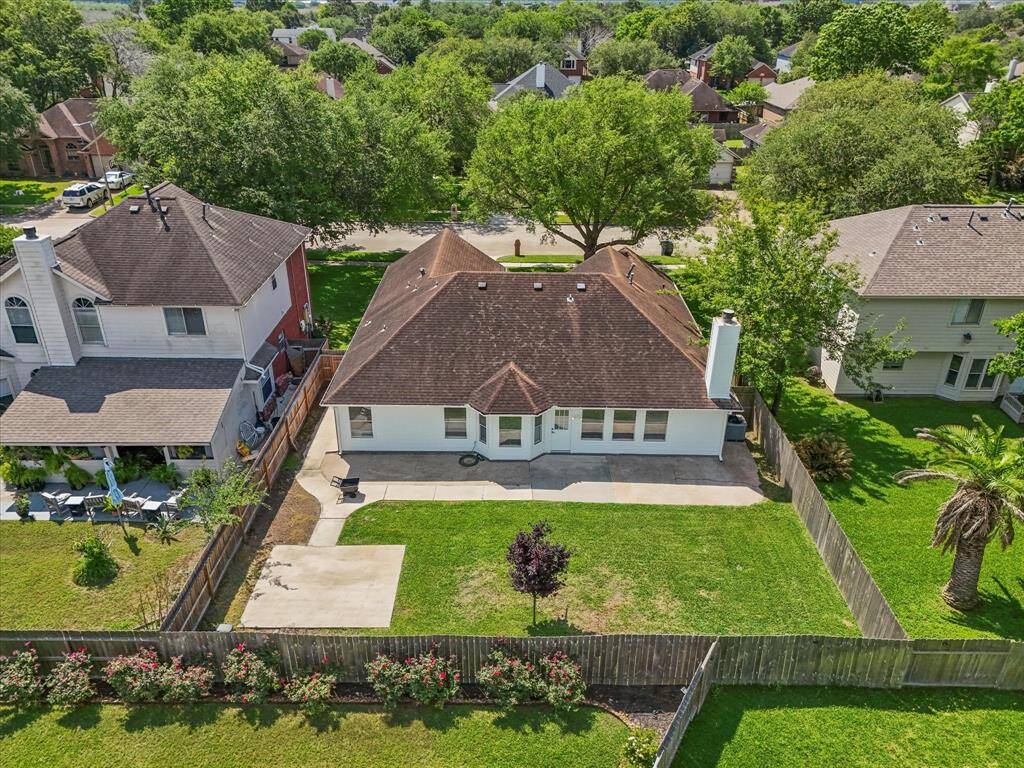 An arial view of the home reveals the concrete pad ready for a storage unit.
