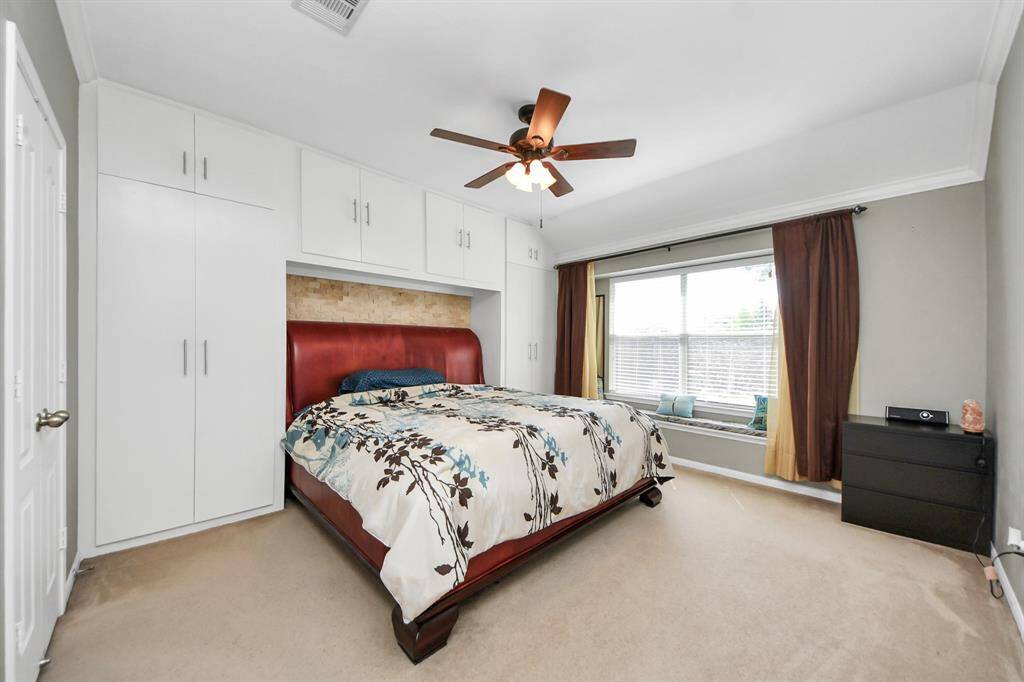Primary bedroom with built in closets