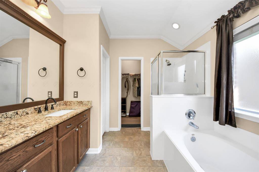 Primary bathroom with tub and shower