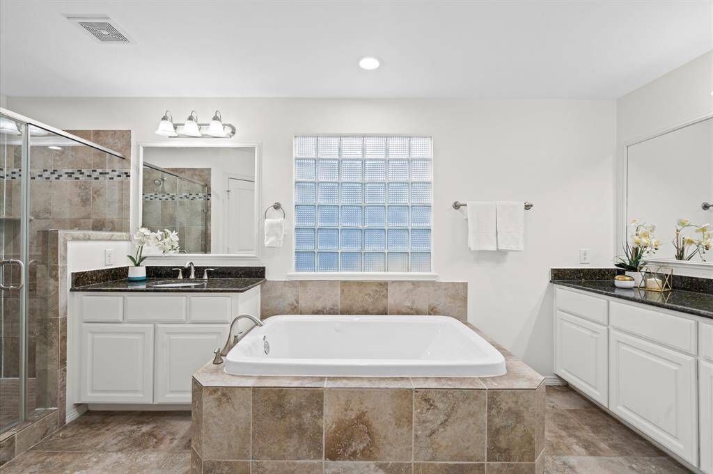 A Bathroom That Feels Like a Spa. Light the candles, grab your favorite bath soak, and exhale. This soaking tub is here to melt your stress away.