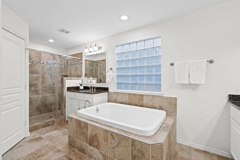 Double Vanity = No More Fighting for Sink Space. Two vanities, tons of storage, and a walk-in shower. Everyone wins!