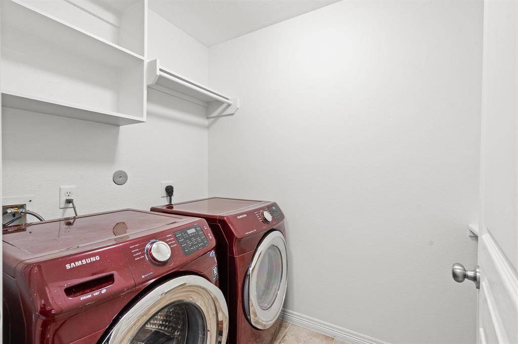 A Laundry Room That Works. Full-size washer and dryer-friendly, built-in shelving, and plenty of room to keep things organized.