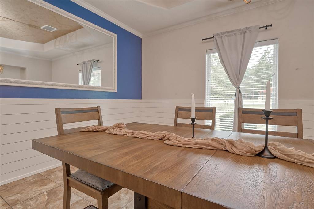 Dining Window Detail – Close-up of the dining table showing sleek candle holders and the room's natural light, highlighting the serene atmosphere for entertaining.