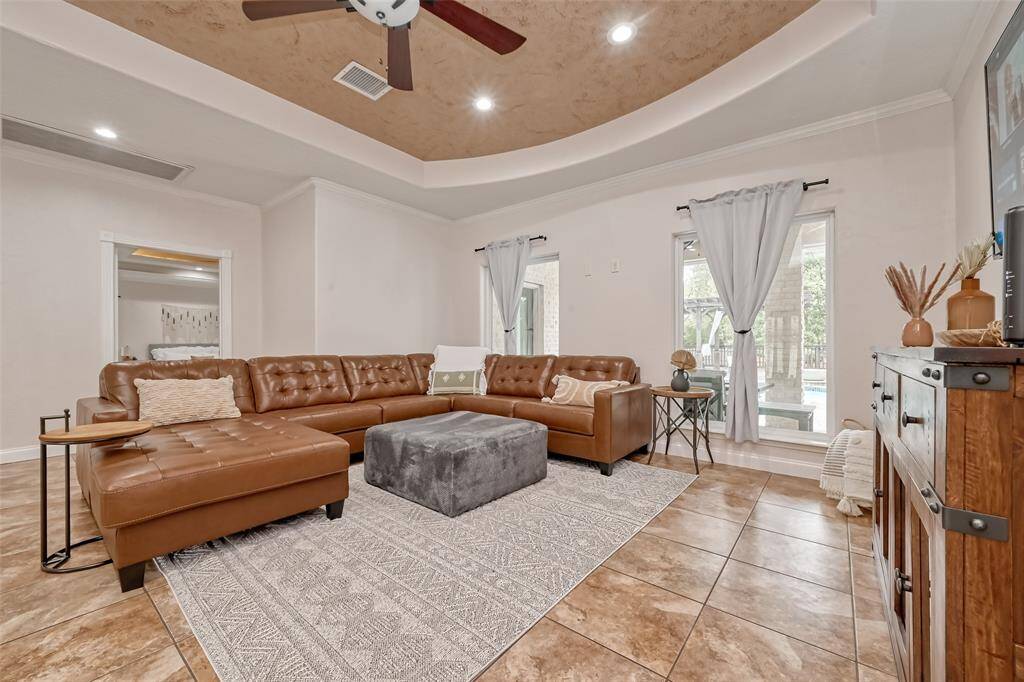 Full view of the living area with ample seating and gorgeous ceiling detail—an ideal blend of comfort and sophistication.