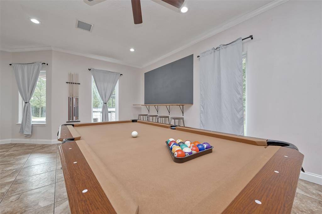 Game Night Ready – Host friends or unwind with a game of pool in this spacious, light-filled game room.