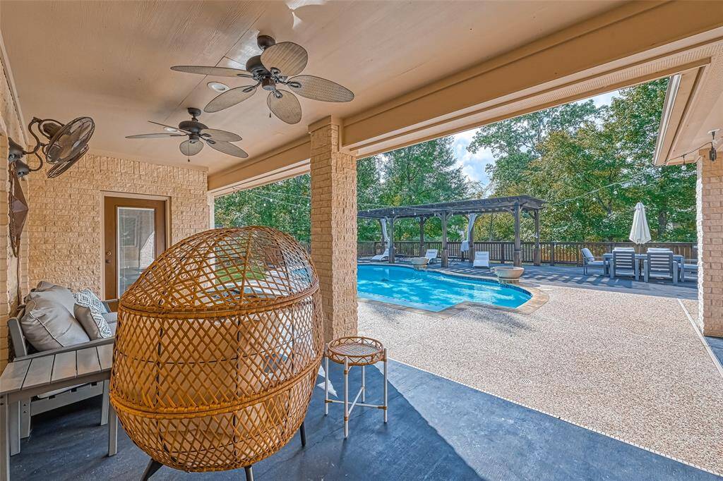 Covered Patio Comfort – Enjoy the breeze and the view from this cozy, shaded outdoor lounge with ceiling fans overhead.