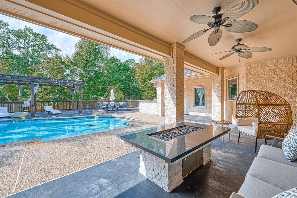 Ultimate Outdoor Lounge – Relax fireside or take a dip—this patio offers the perfect blend of comfort and style.