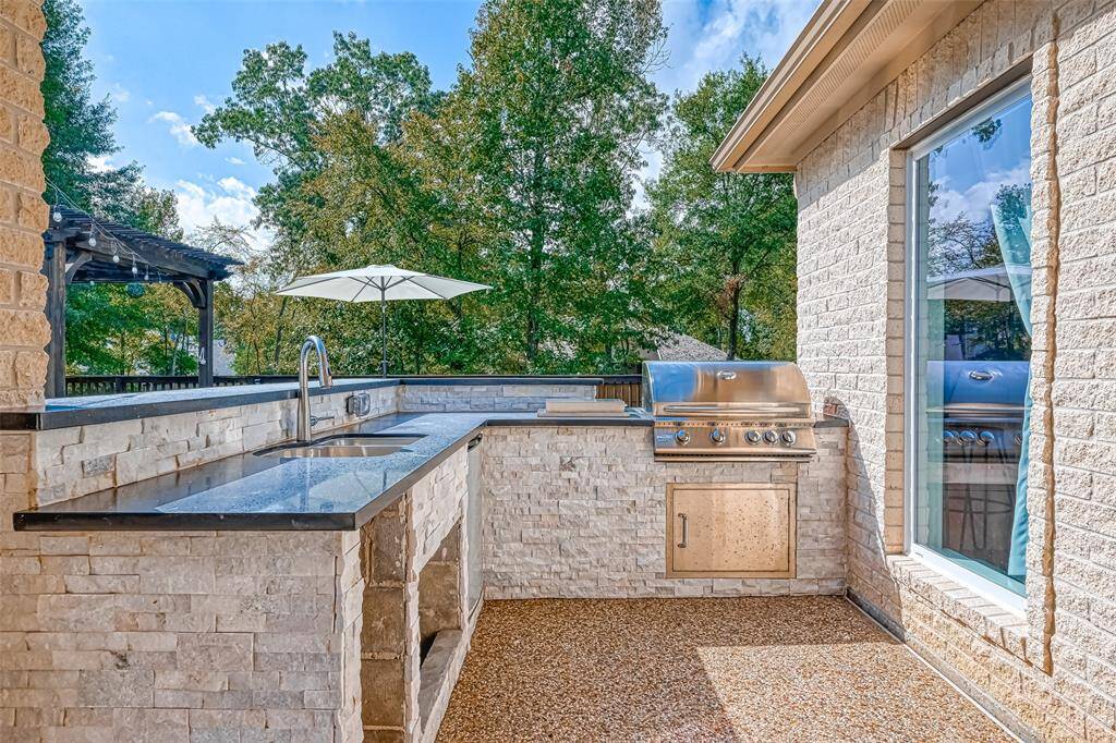 Outdoor Kitchen DreamGrill and entertain with ease in this fully equipped outdoor kitchen featuring sleek granite counters and stainless appliances.