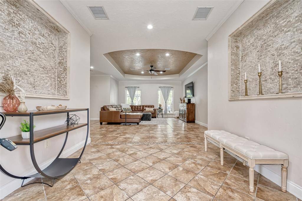 Open-concept layout leads from the front door into a beautifully designed living space with natural light and stylish finishes.