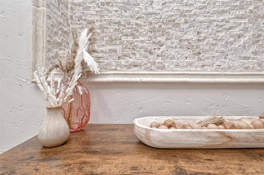 Modern rustic charm captured in a detailed close-up of the decor—stone backsplash, natural wood tones, and thoughtful accents throughout.