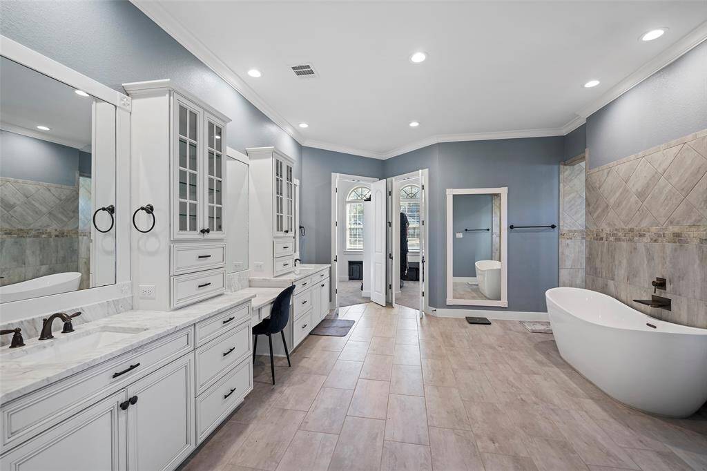 Notice all the cabinetry and vanity area.