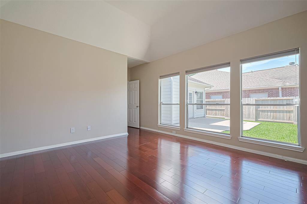 Primary Bedroom offering lots of windows for natural light and a view of your beautiful backyard