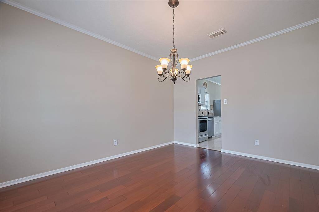 Formal Dining Room opens to the kitchen, perfect for entertaining