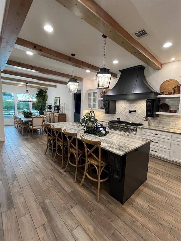 Gourmet kitchen open to massive dining space